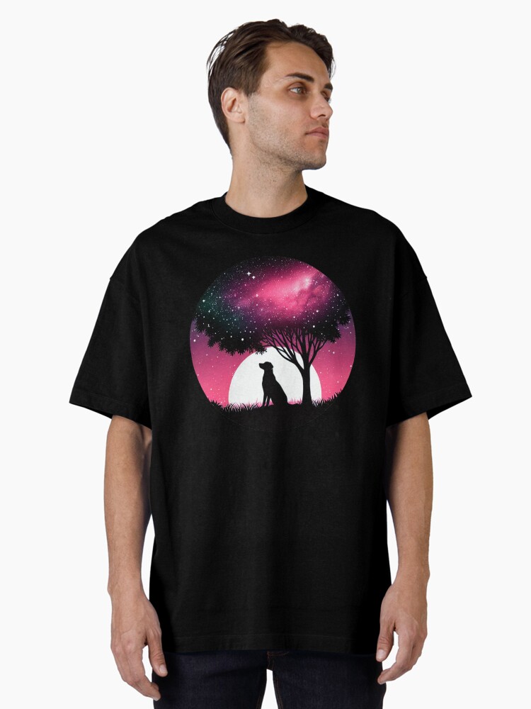 A silhouette of a dog sitting under a tree Oversized T-Shirt